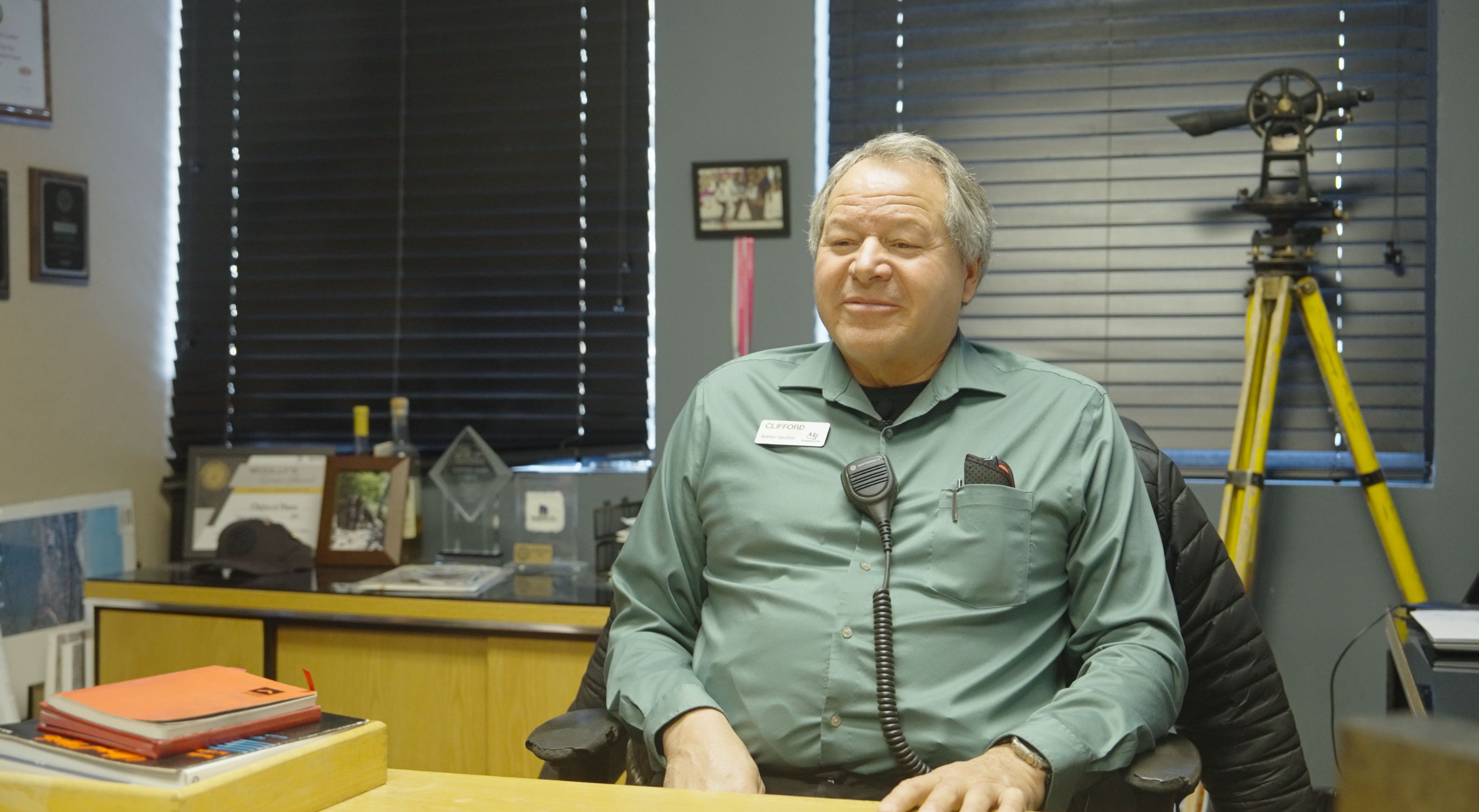 Clifford Mann sitting at his desk in Mammoth's lodge.