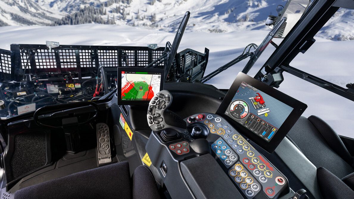 The high-quality interior lining in the cockpit of the PistenBully 400 A freshly groomed slope.