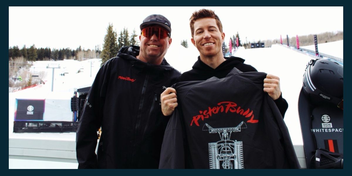 Three models wearing a backpack, a sunshirt, and a tank top from PistenBully.