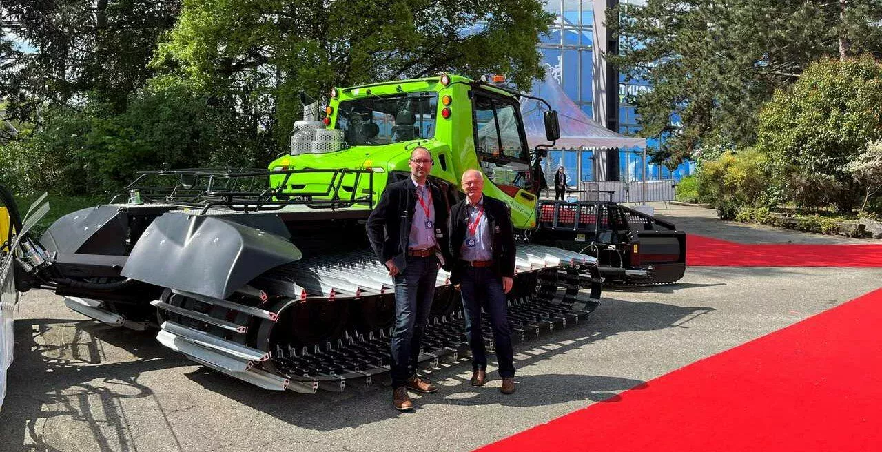 Seethaler and Dehm in front of a PistenBully